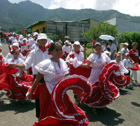 Children dancing in Boyeros Parade, Escazu, Costa Rica